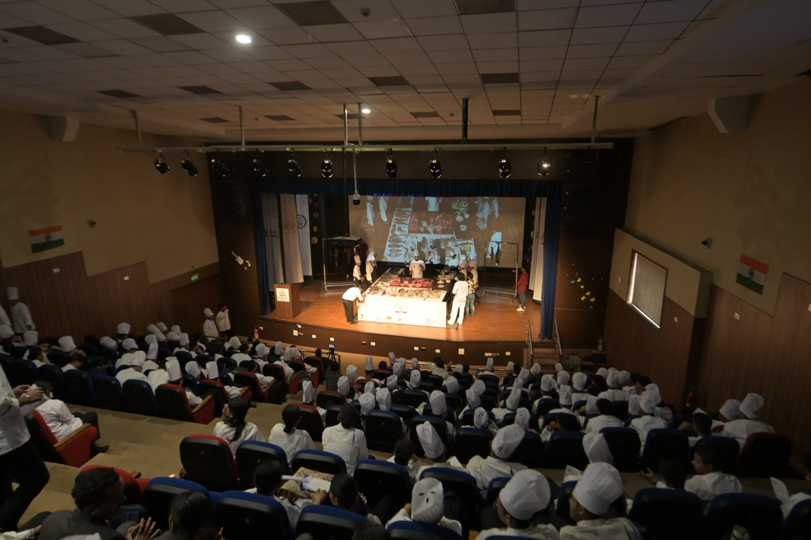 Wide view of hospitality students filling the auditorium during the seafood workshop demonstration at IHM Bhopal