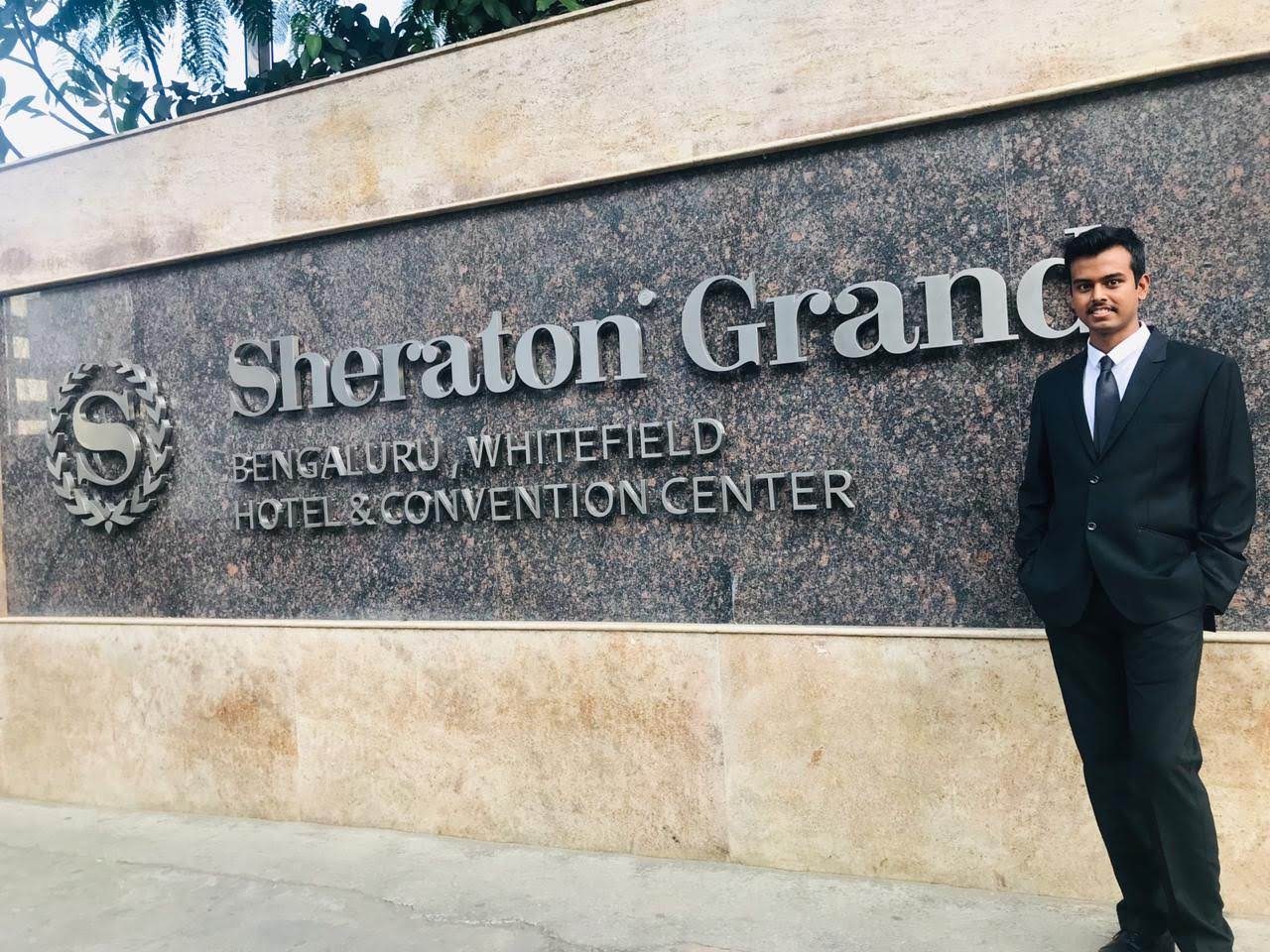 Chef Mohammad Husain at the Sheraton Grand Bengaluru Whitefield sign
